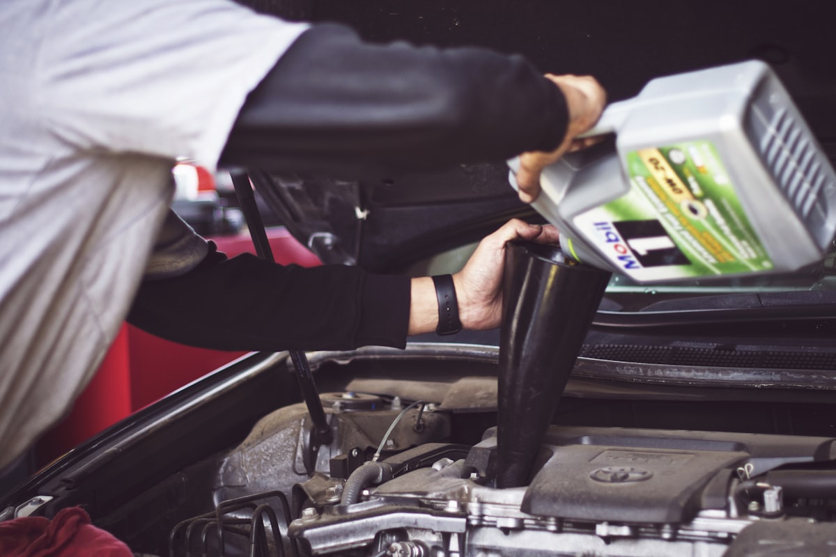 Technician working in an engine bay
